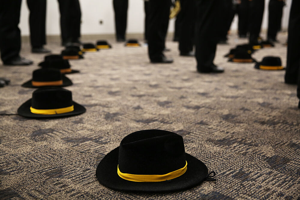 The marching band took their hats off for the final rehearsal